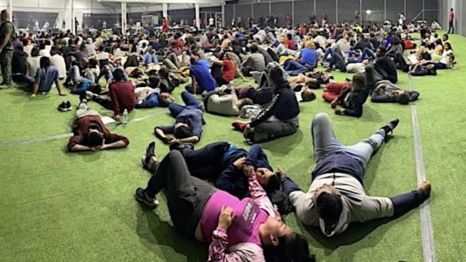A picture leaked from inside the massive government tent facility near Eagle Pass, Texas, shows several hundred people waiting to be processed in an area intended for recreation. (Courtesy image)