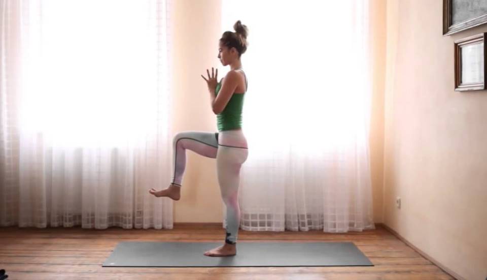 woman doing yoga at home